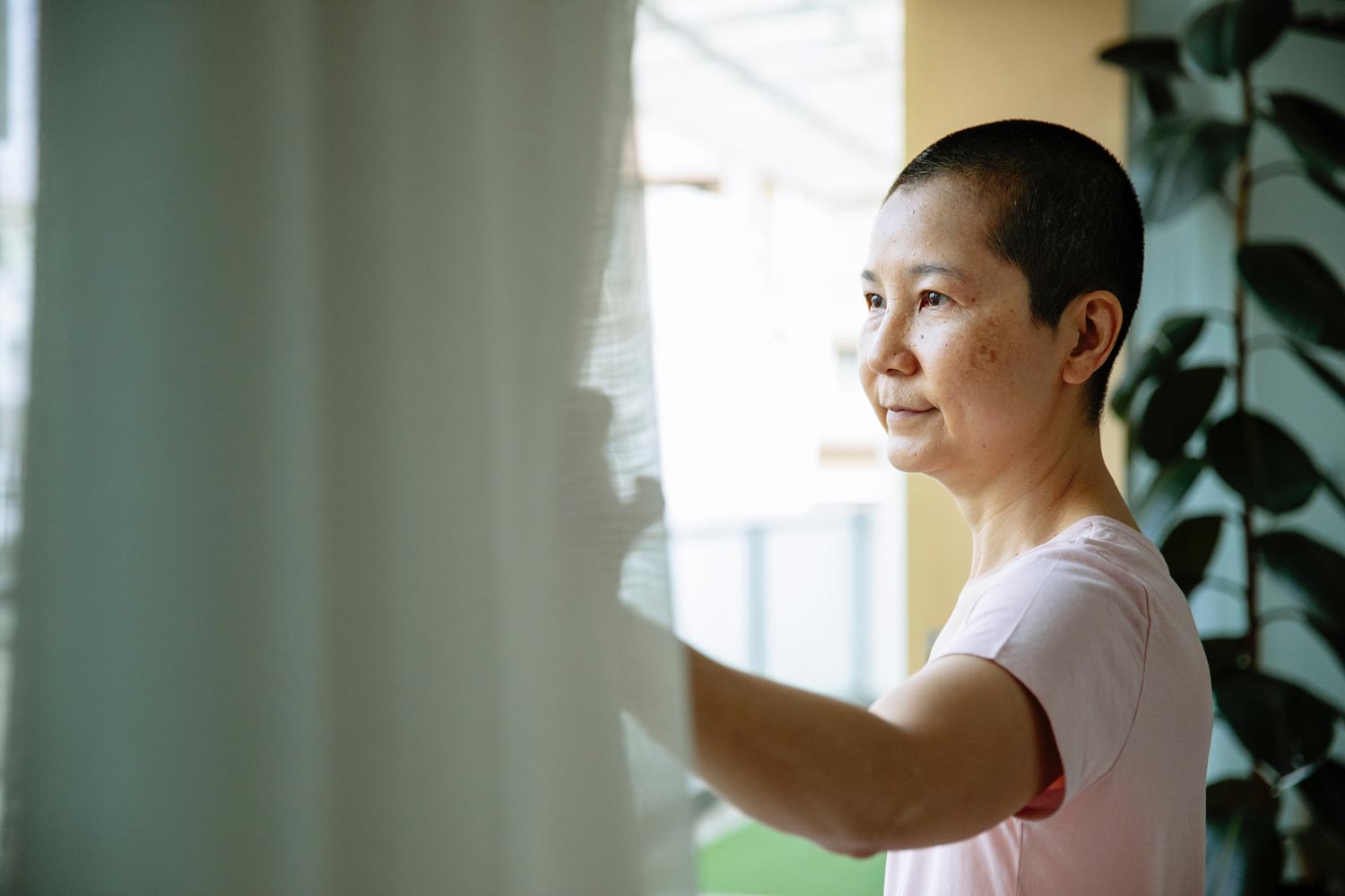 Woman looking out of window