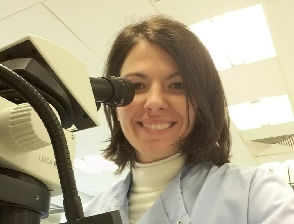 Dr Samanta in the lab with a microscope