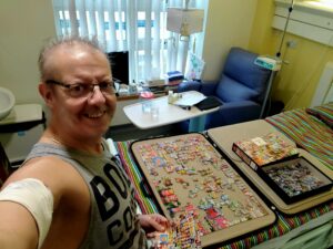 Andi doing his puzzle in hospital