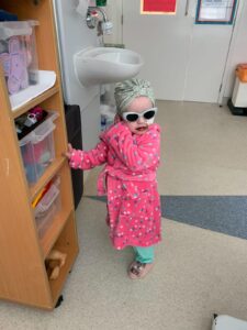 Summer on the ward wearing sunglasses and lipstick