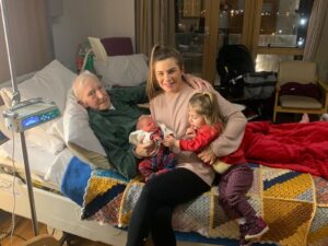 Denis with his new grandchild 5 days before he died