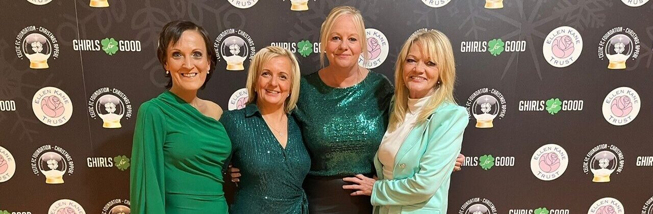 Nichola with her friends standing arm by arm with each other