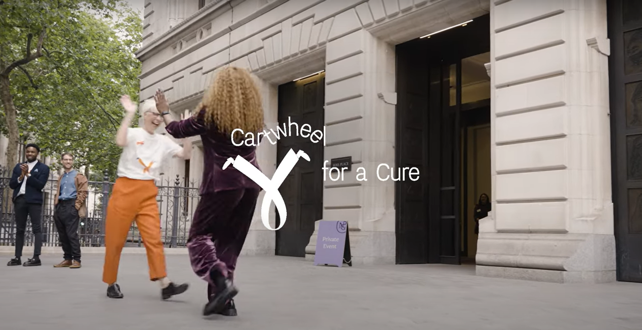 Lucy and team cartwheeling outside