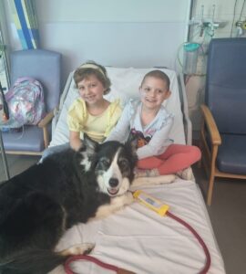 Lacie with her best friend Betsy and a therapy dog