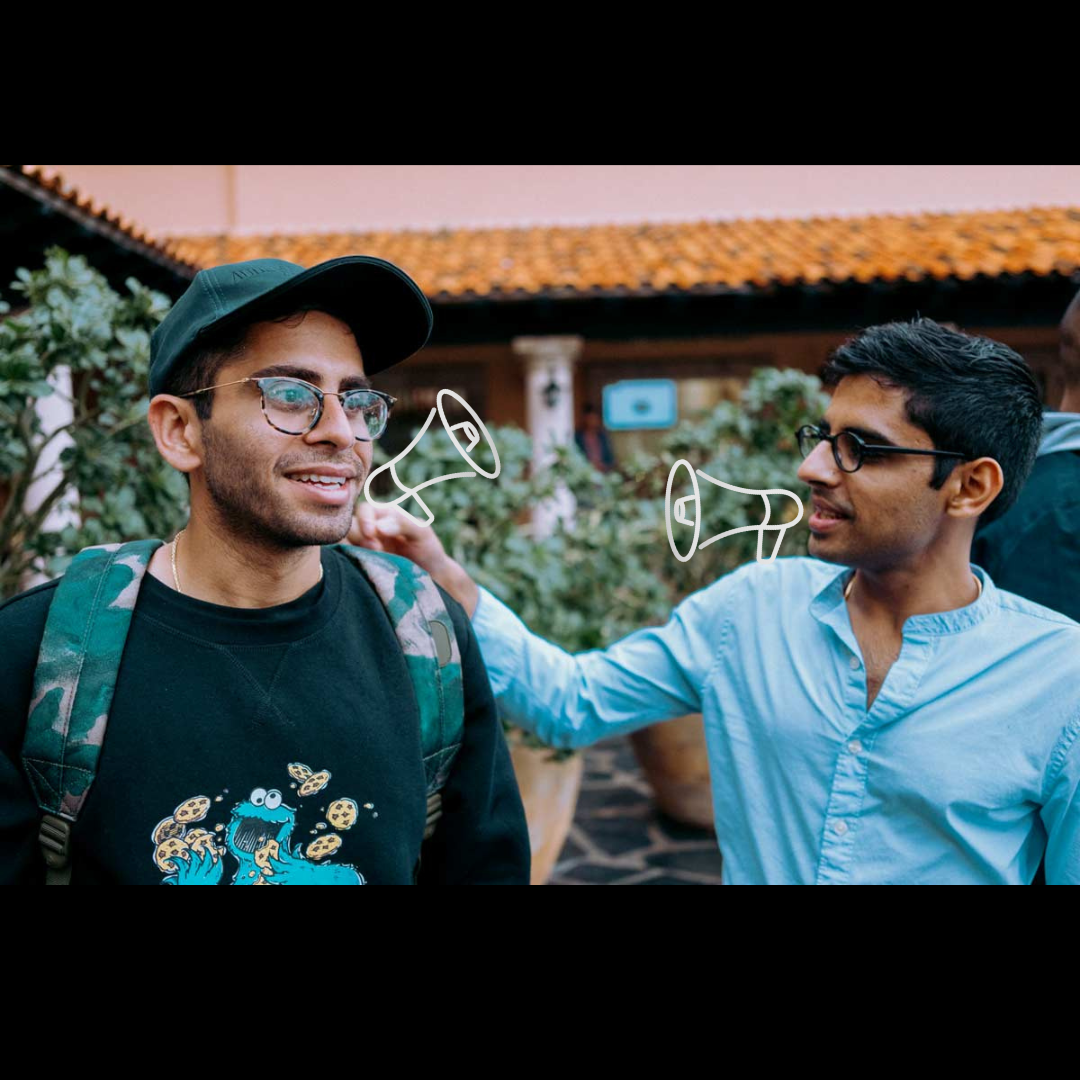 image of two men talking to each other